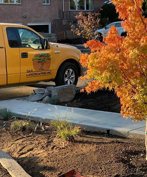 Irrigation systems, concrete curbs, plant design, and landscape rocks with grass seed in Fircrest 
